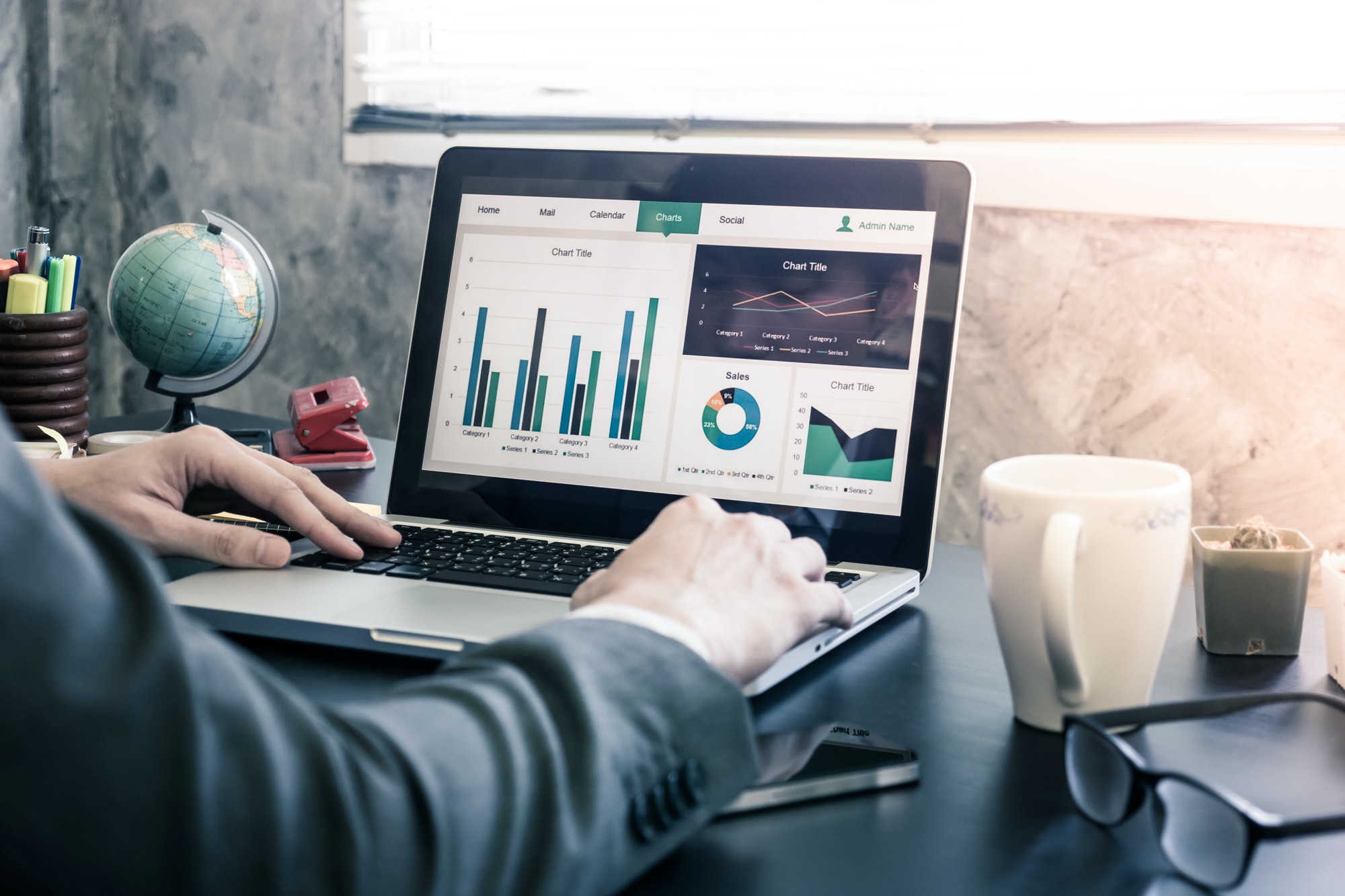 businessman-analyzing-investment-charts-on-the-office-desk-.jpg